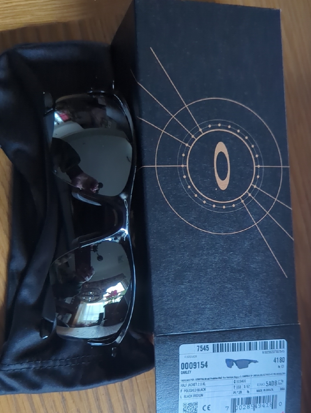 Oakley Polished Black Sunglasses with Mirrored Lenses